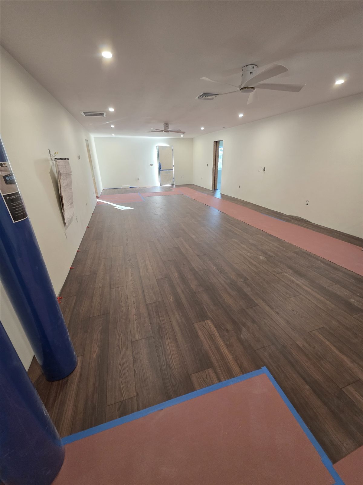 Wood-look plank flooring installed in a large open room, Tampa Bay, FL