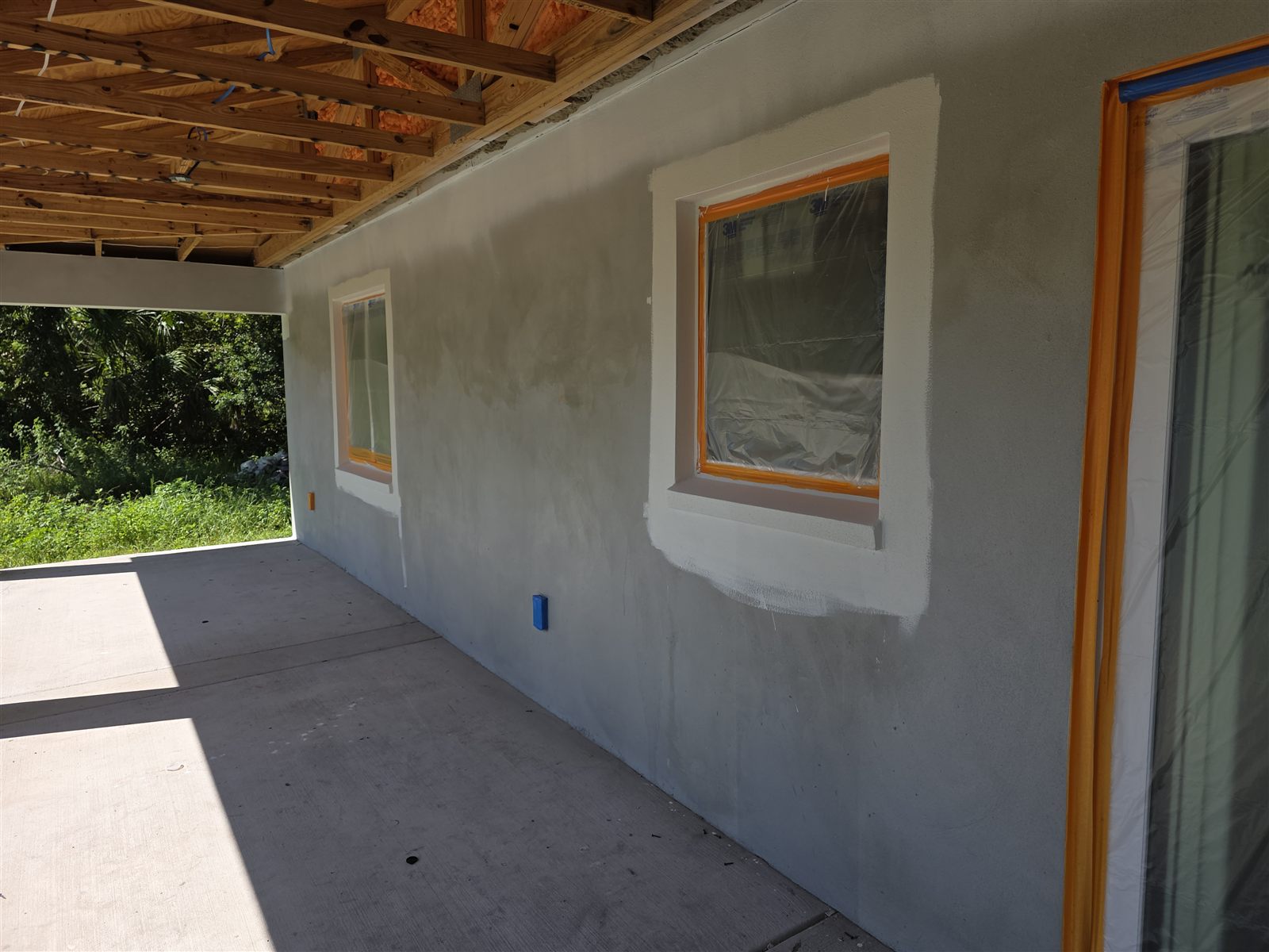 Stucco exterior prepped and taped for painting, Tampa Bay, FL