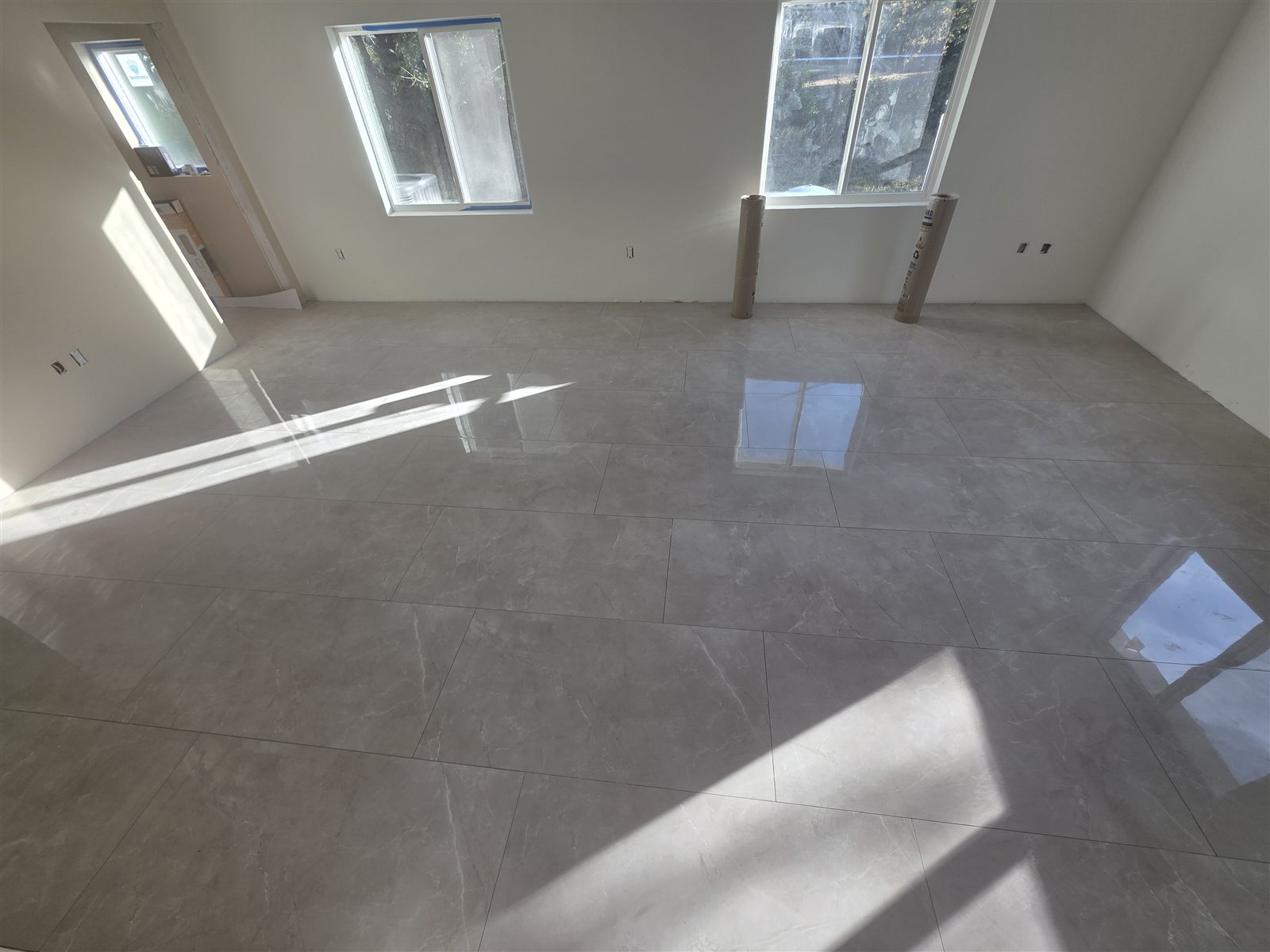 Large-format polished floor tile, wide room view, Tampa Bay, FL