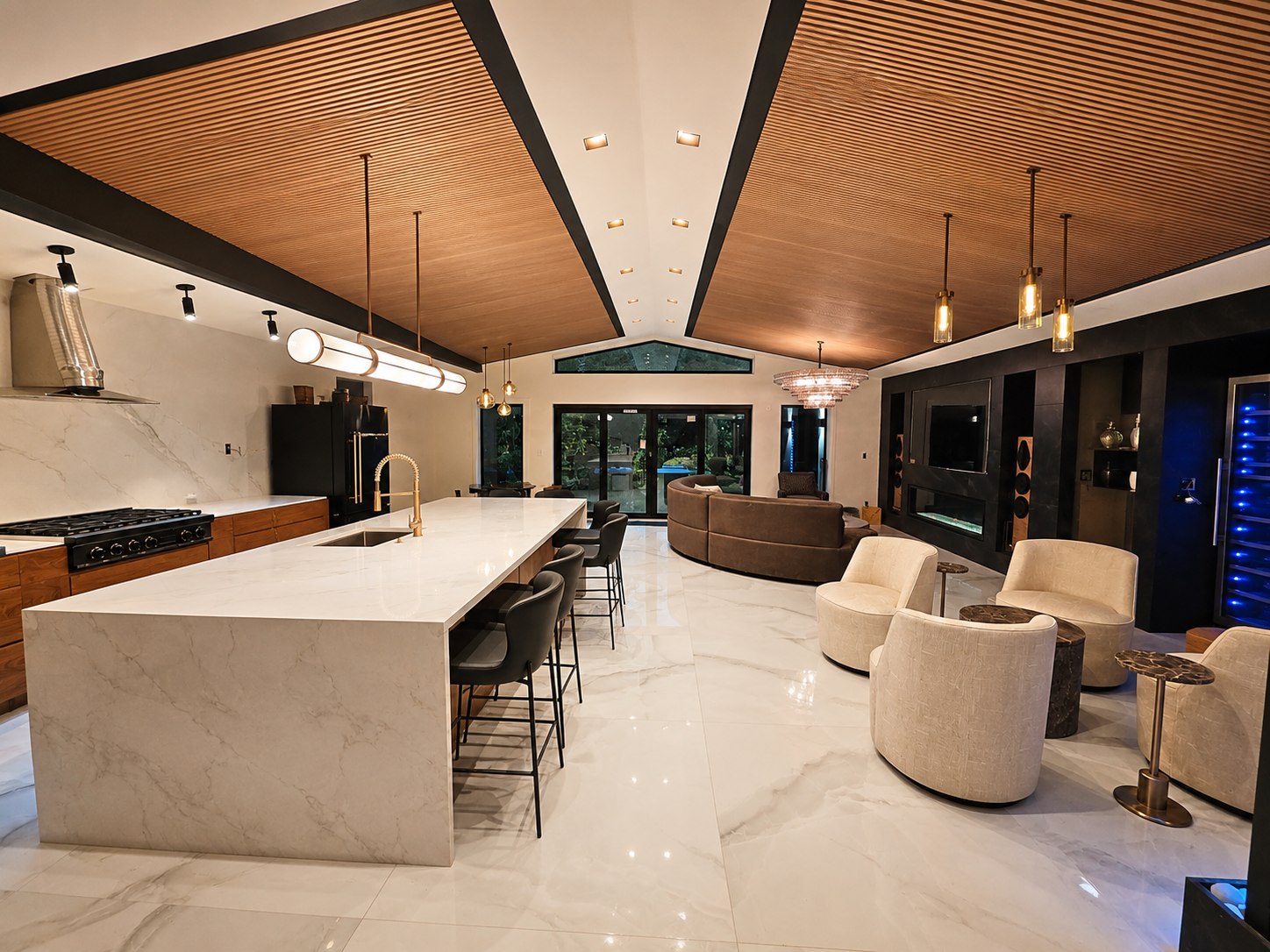 Full kitchen and great room renovation with marble waterfall island, wood slat ceiling, and gold fixtures, Tampa Bay, FL